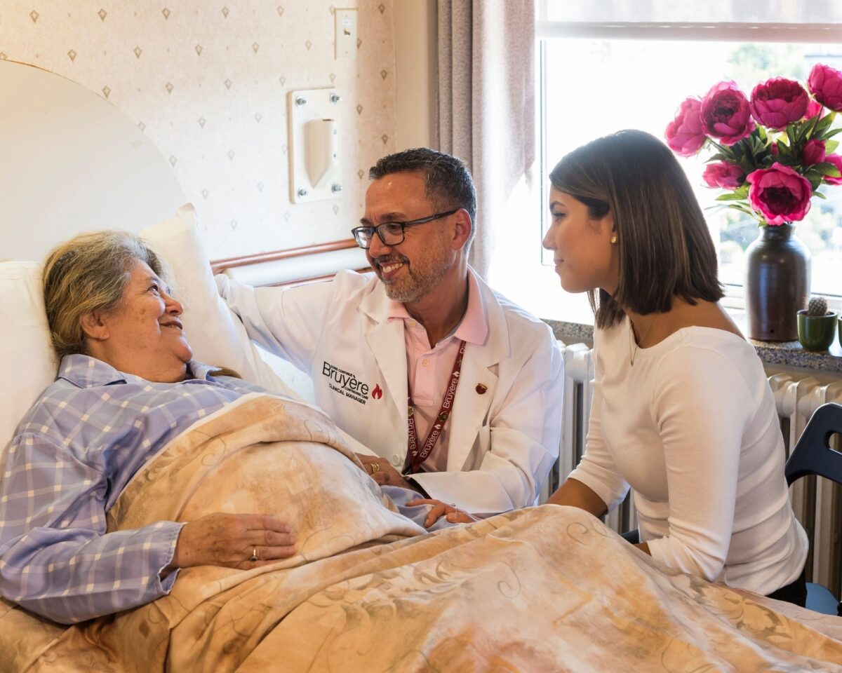 Bruyère Palliative Care Unit patient with staff and family member